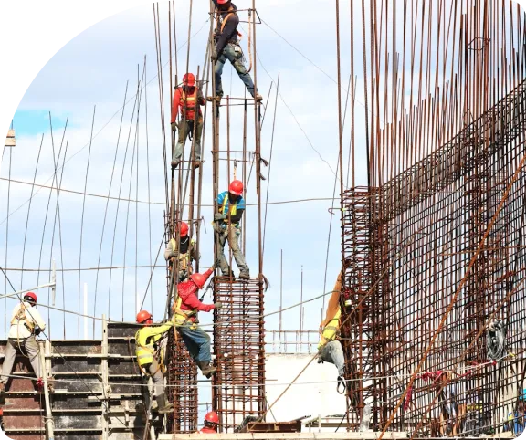 Labourers working on a construction site in UAE, highlighting labour cancellation services.