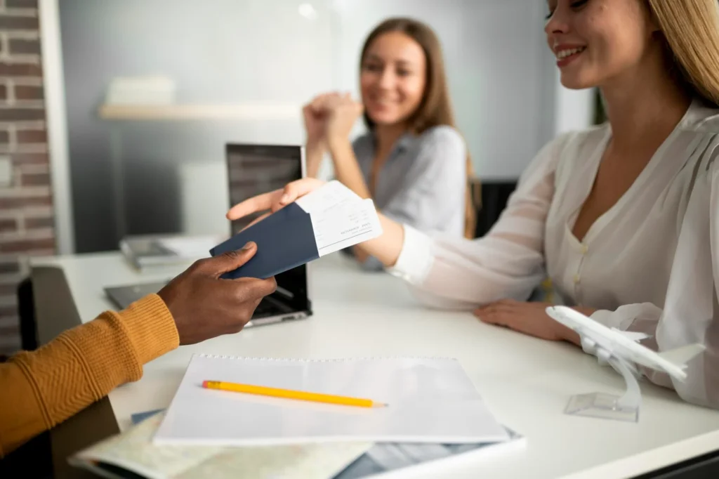 Woman handing a passport to a consultant for visa issue resolution