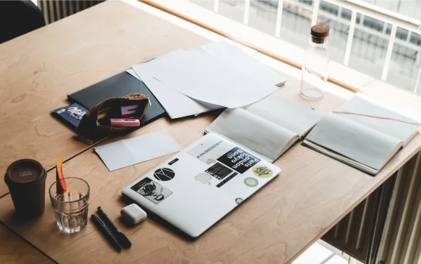 Office desk with legal documents required for investor visa cancellation