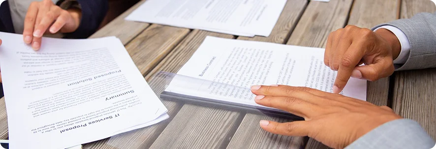 Professionals reviewing documents to check UAE Blue Visa eligibility